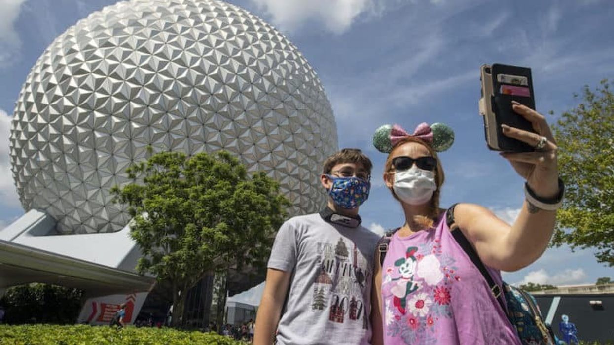 theme parks coronavirus guests wearing masks at Epcot Disney