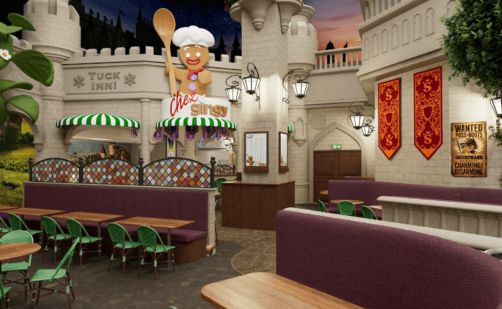 Themed restaurant interior with castle decor and giant gingerbread chef sign.