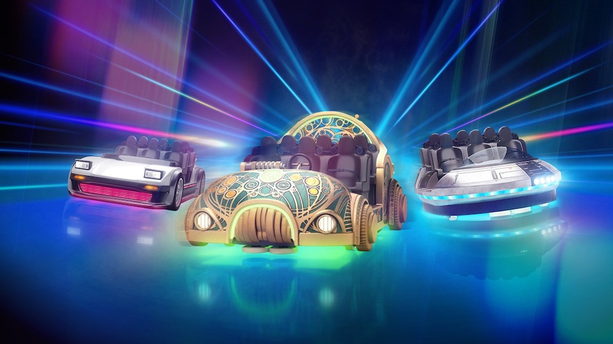 Three futuristic cars with colorful lights on a glowing, reflective surface.