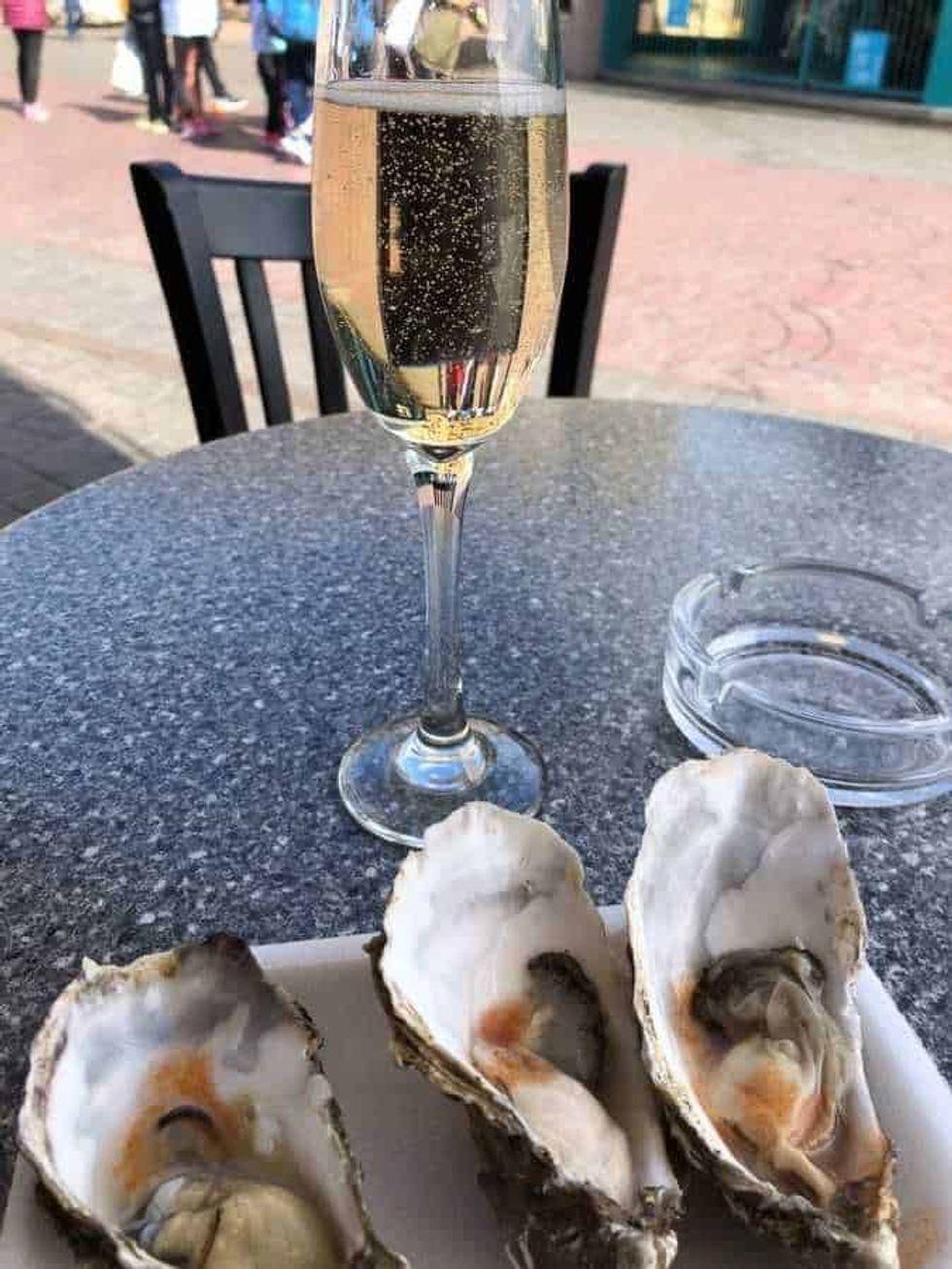 Three oysters and a glass of champagne