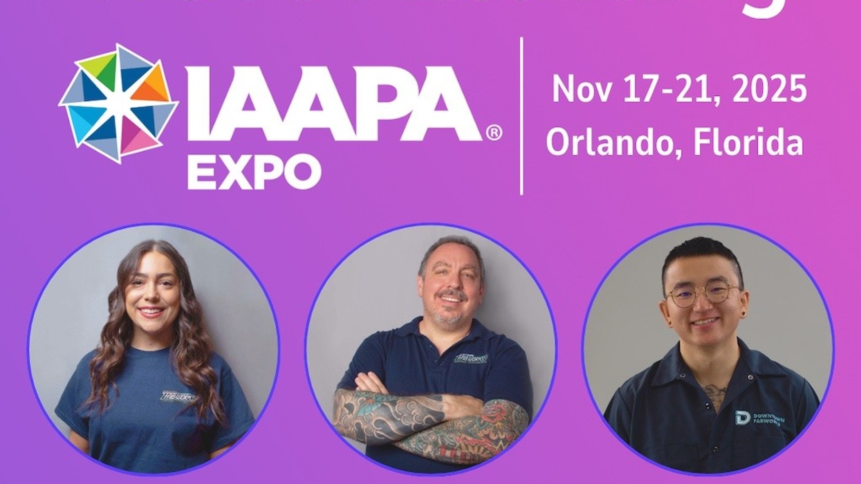Three people attending IAAPA Expo; Nov 17-21, 2025, Orlando, Florida.