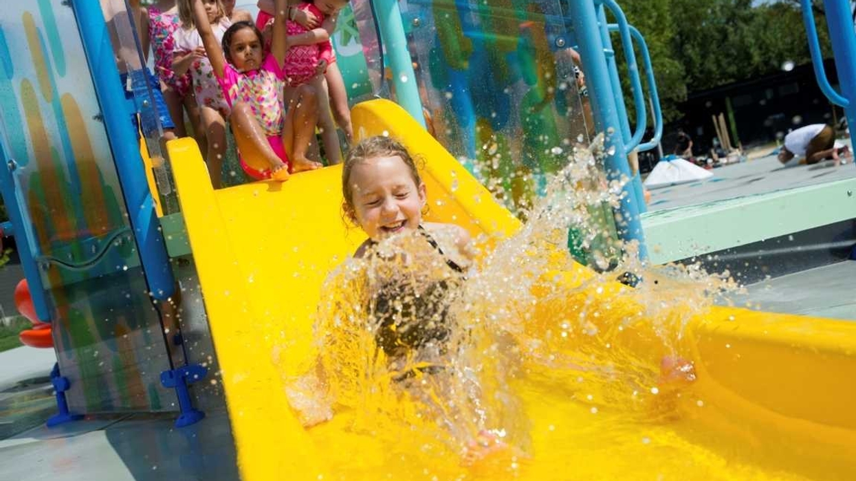 toddler on playnuk waterslide by vortex