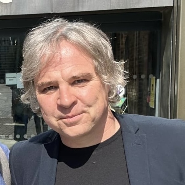 Tony Butler wearing a blazer