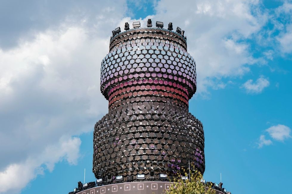Top of Media Matrexx \u2014 High-Tech Landmark of the Urban Core with blue sky in the background