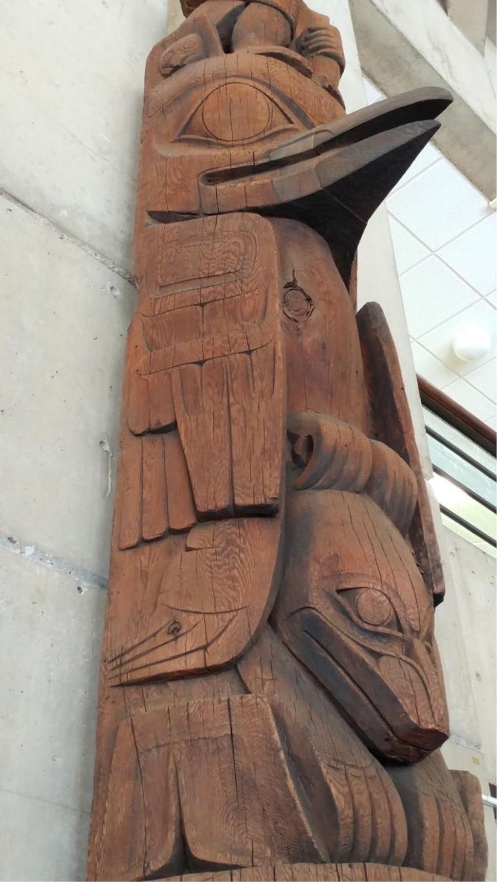 totem pole against stone