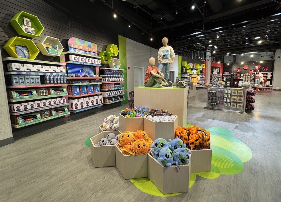 Toy store interior with colorful displays and stacked plush toys.
