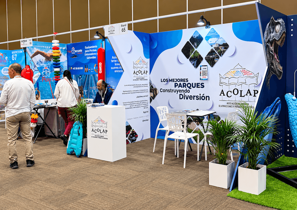 Trade show booth with Acolap branding and informational displays.