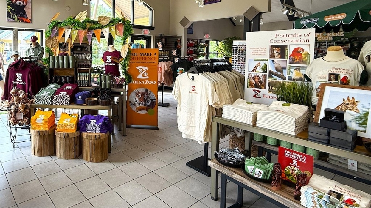 Tulsa Zoo gift shop with shirts, plush toys, and conservation displays.