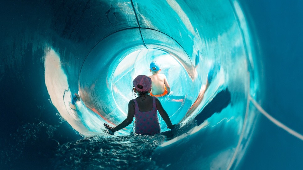 Two children on water slide at aquapark