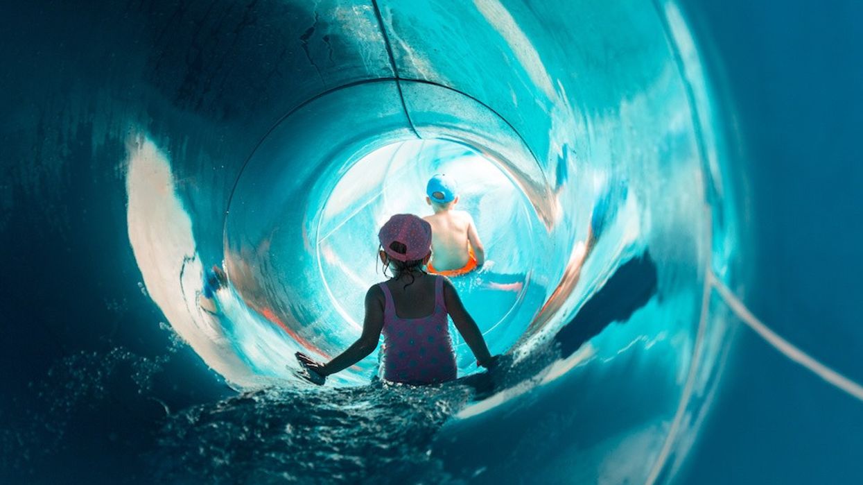 Two children on water slide at aquapark