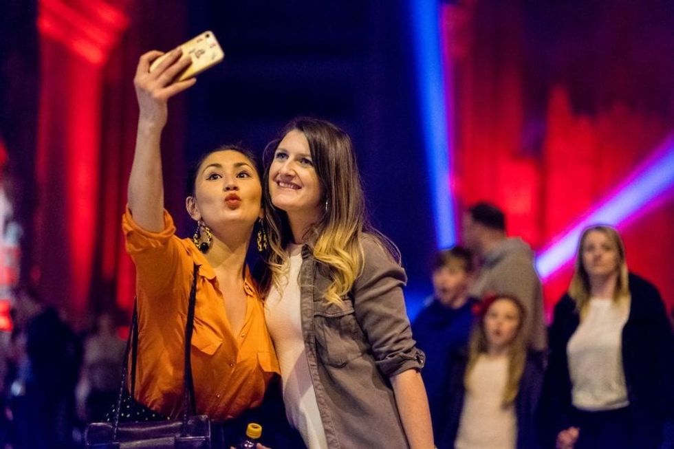 Two friends taking a selfie at Liverpool Light Night