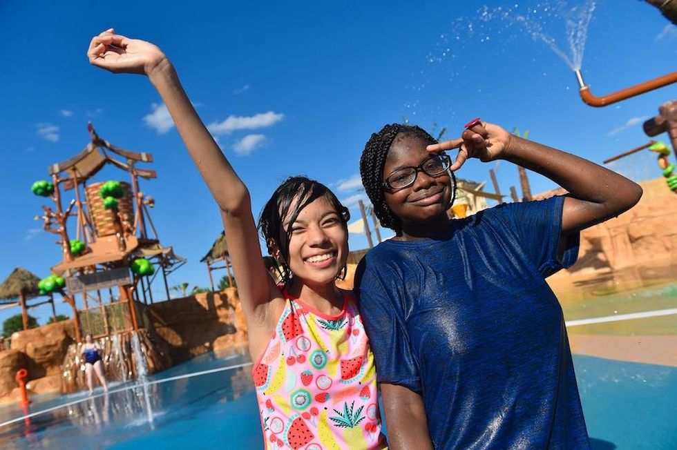 two girls play at morgans inspiration island whitewater