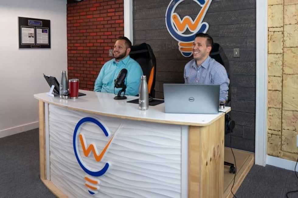 two hosts at amusement 360 event from creative works