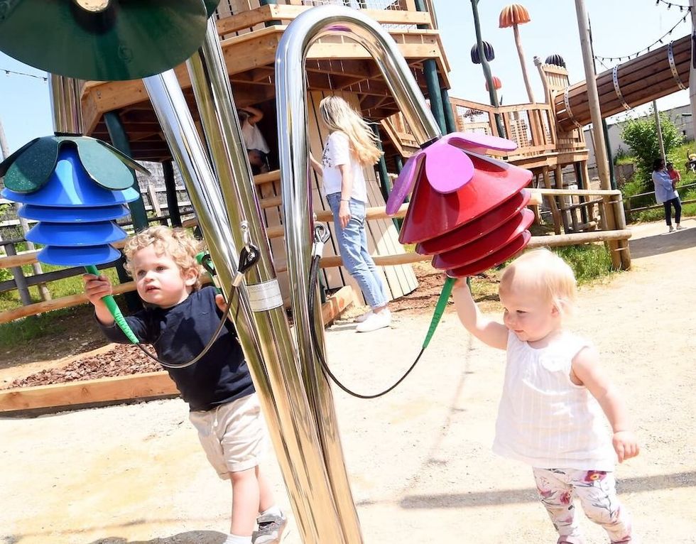 two-kids-enjoying-the-acoustic-instrument-at-Fairytale-farm-with-new-adventure-play-the-Fairy-Dell-by-CAP.Co_