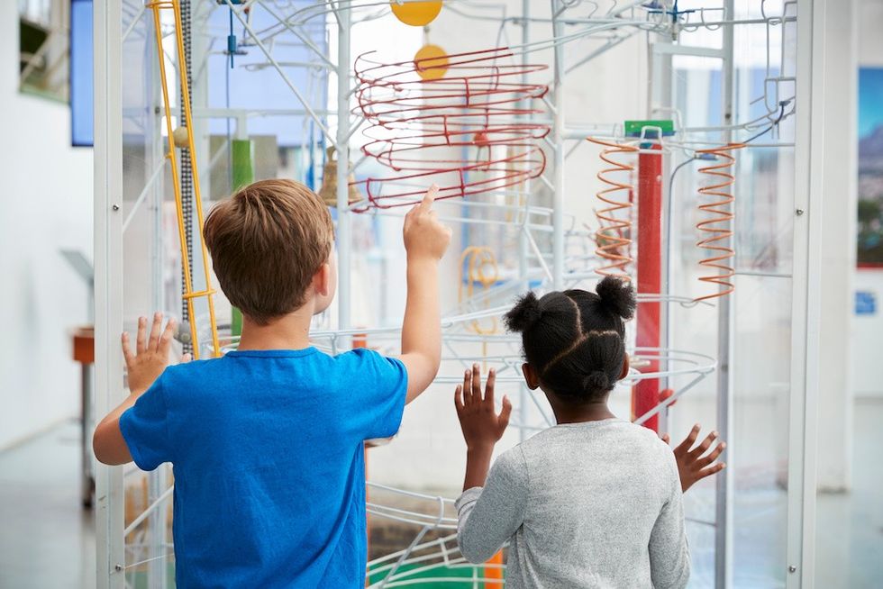 Two kids looking at a science exhibit visitor experience advocacy