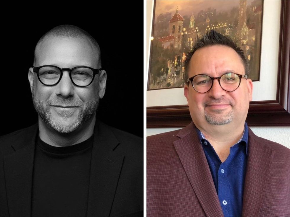 Two men wearing glasses, one in black and white, the other in color with a painting background.
