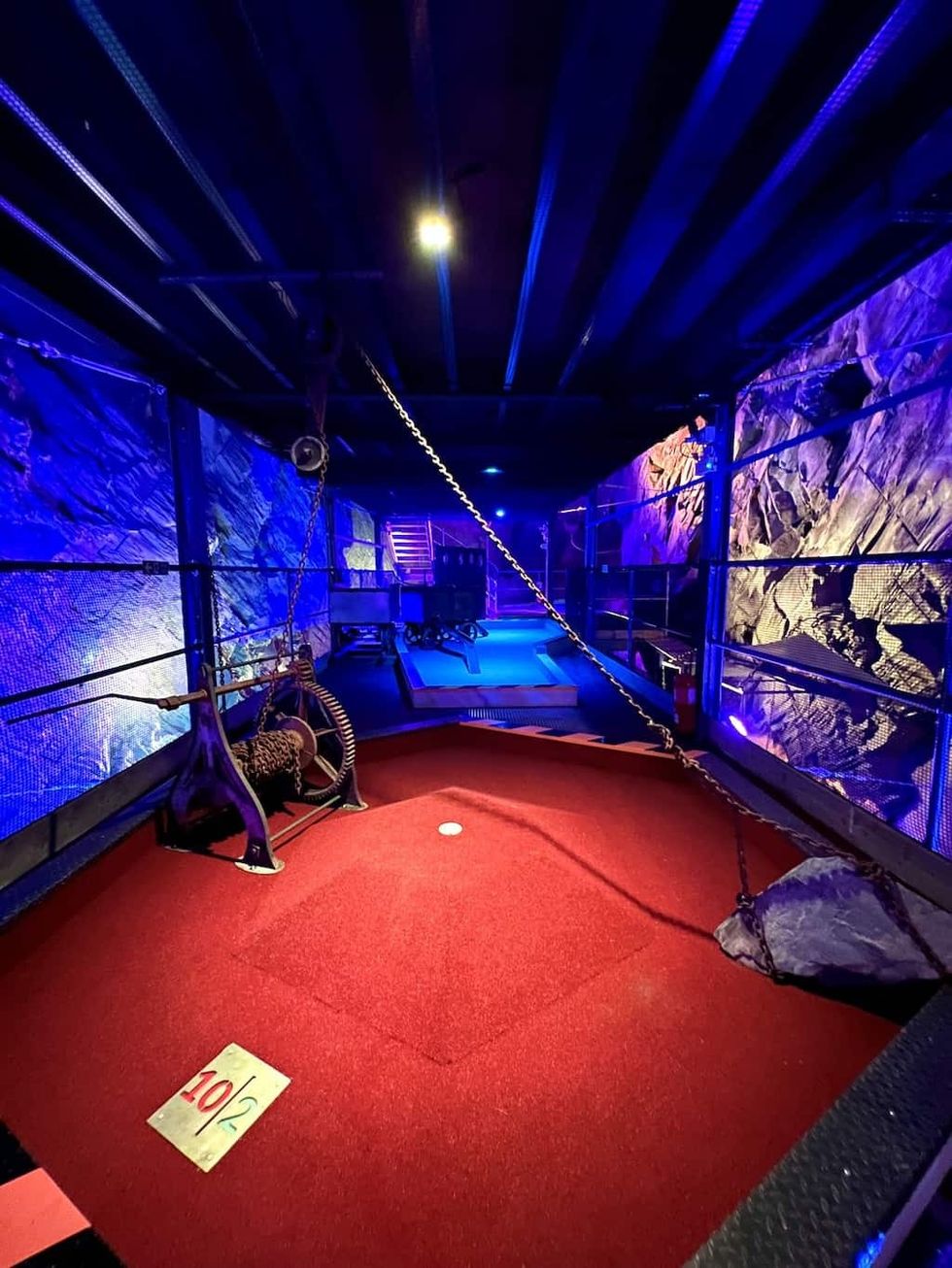 Underground golf zip world