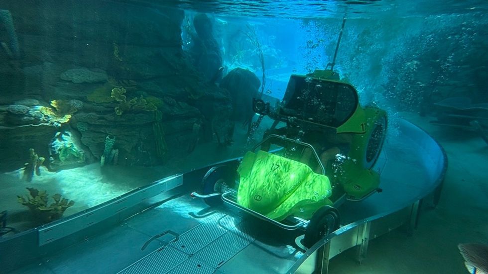 Underwater vehicle on a track in an aquarium exhibit.