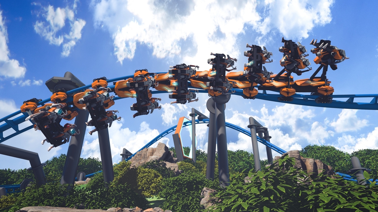 Upside-down roller coaster ride called Thrill Glider with blue sky and clouds backdrop.