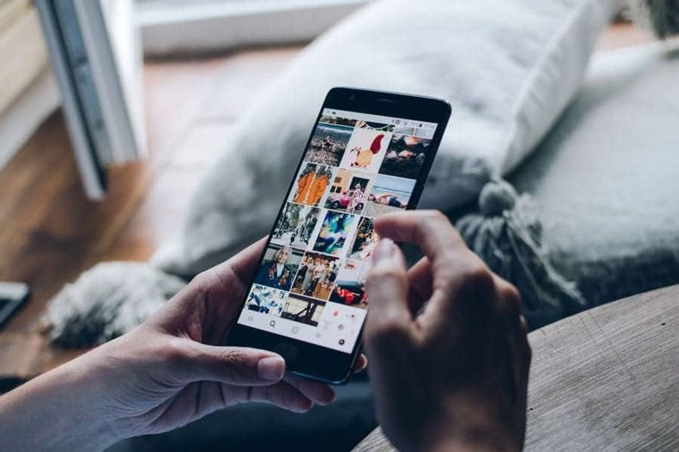User scrolling through instagram 10 travel trends blooloop