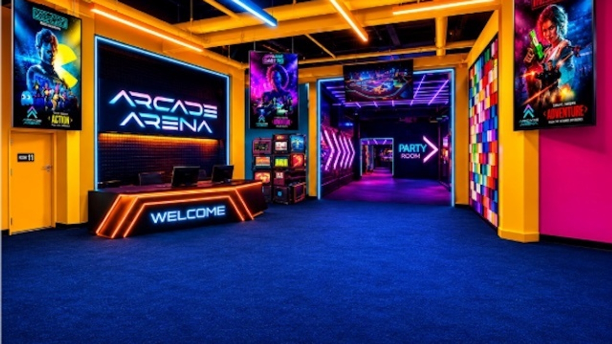 Vibrant arcade entrance for Arena Arcade with neon lights, colorful walls, and gaming posters.