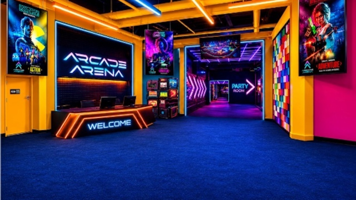 Vibrant arcade entrance for Arena Arcade with neon lights, colorful walls, and gaming posters.