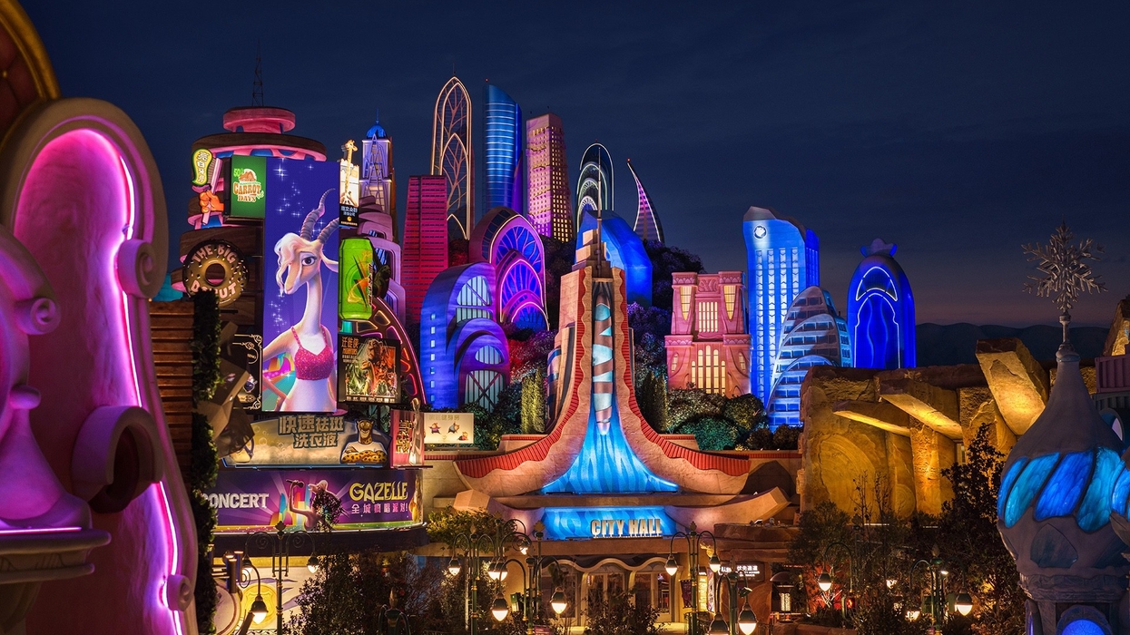 Vibrant, illuminated cityscape with colorful neon lights and animated billboards at night, Zootopia at Shanghai Disney