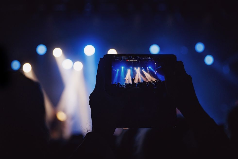 Video recording of the concert on a mobile phone or a smartphone.