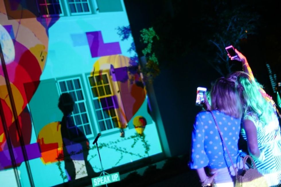 viewers take selfies at digital graffiti art festival