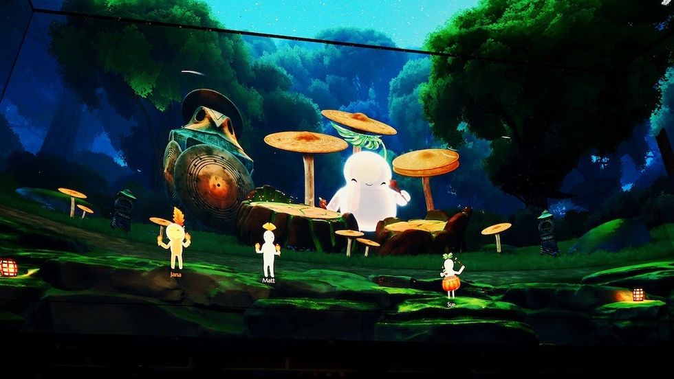 Virtual forest scene with animated characters and large mushrooms.