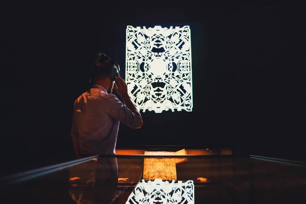 visitor listening to audio at Hans Christian Andersen Museum