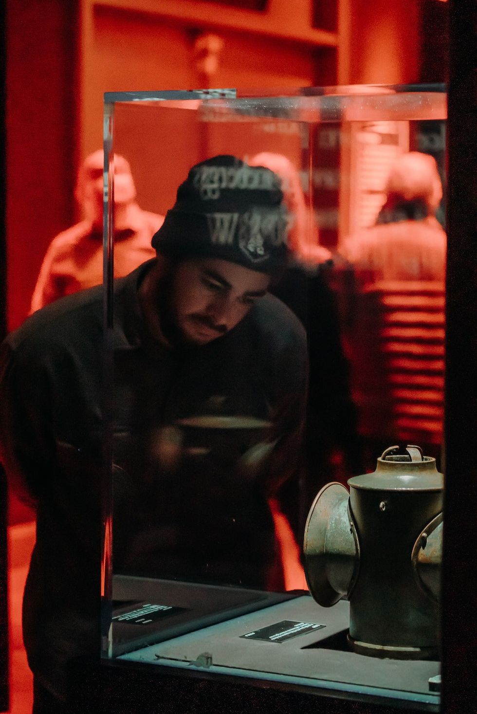visitor reads information about an artefact Titantic exhibition