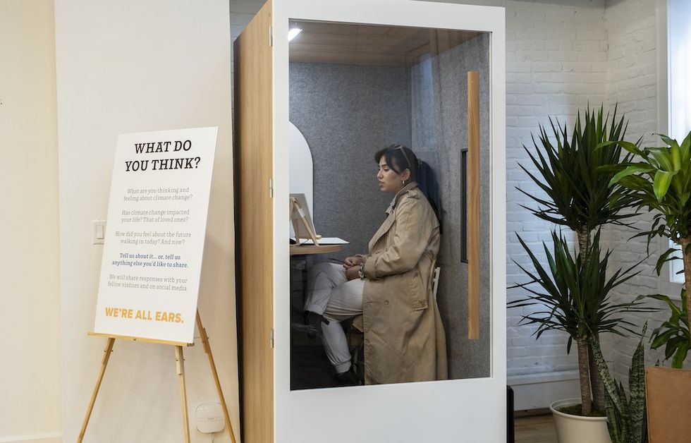 Visitor records their thoughts at The Climate Museum PopUp