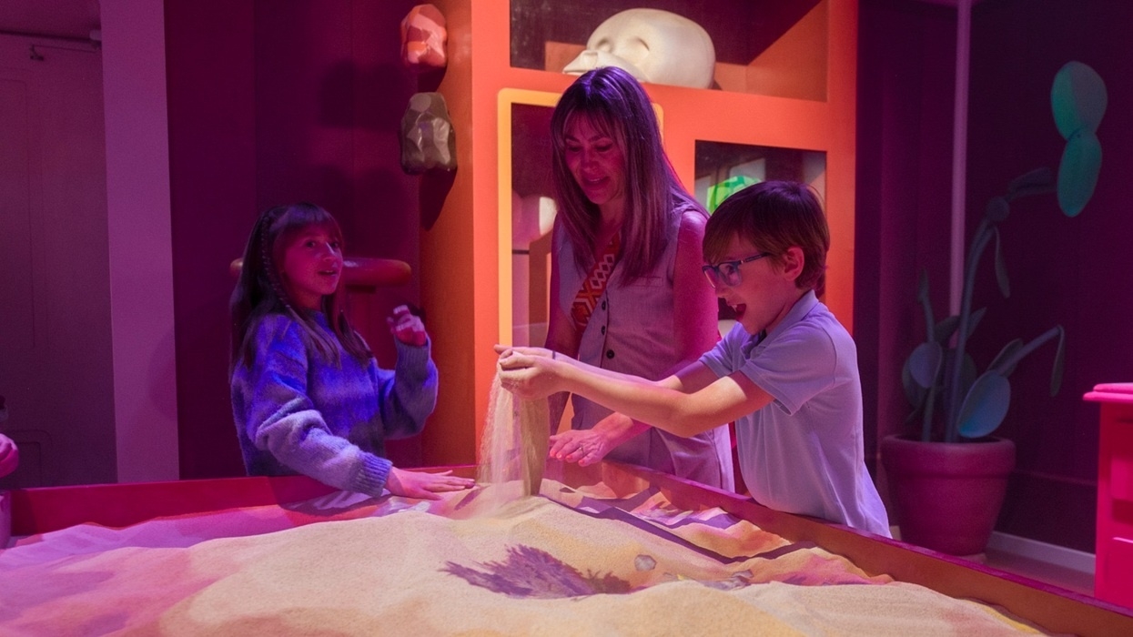 Visitors playing in an Animated Sandbox at Bluey’s House