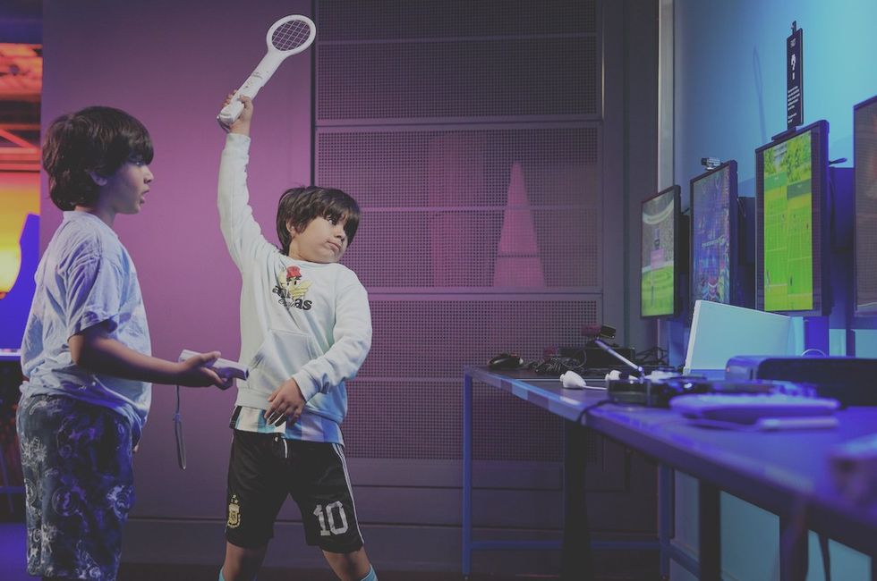 Visitors playing Wii Sport in Power Up, the Science Museum’s hands-on gaming experience