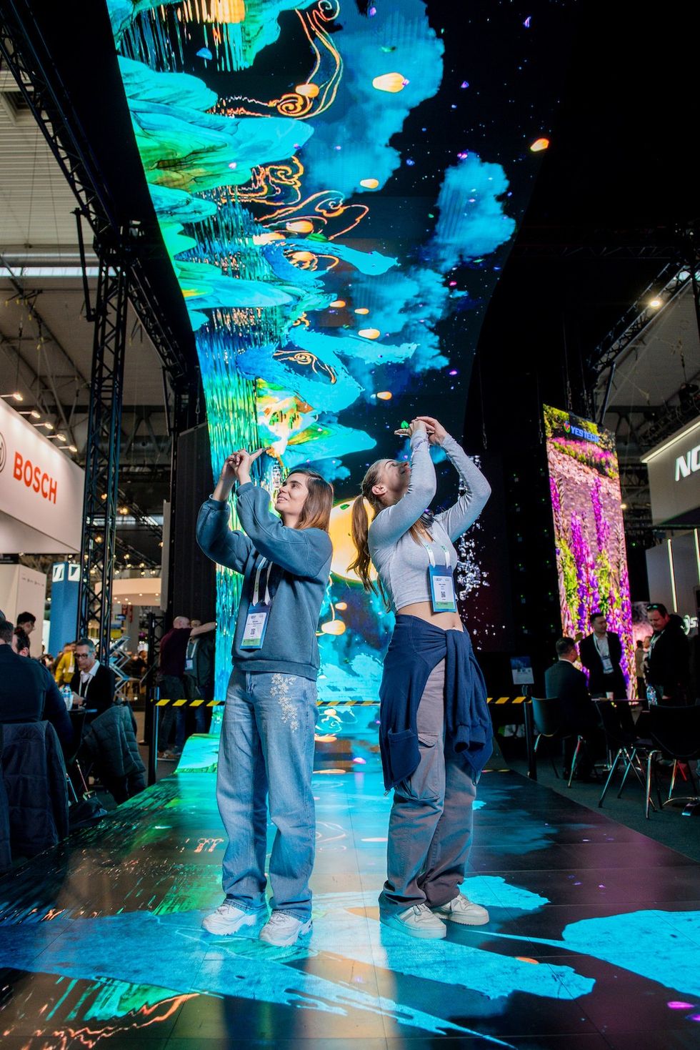 visitors take pictures of immersive tech at ISE 2024
