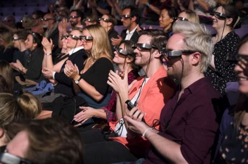 Visitors using Epson smart glasses at National Theatre