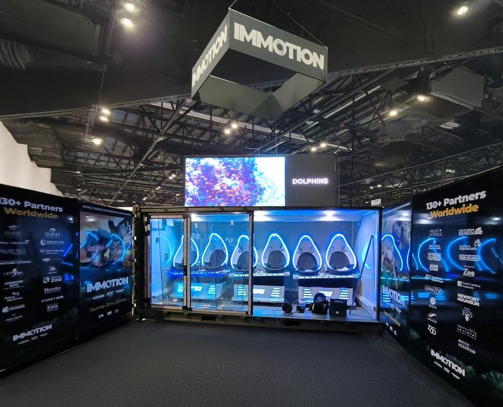 VR experience booth at an expo, showcasing Immotion's dolphins attraction.