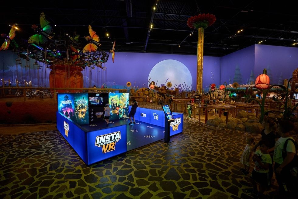 VR gaming area with fantasy decor and large butterfly carousel.