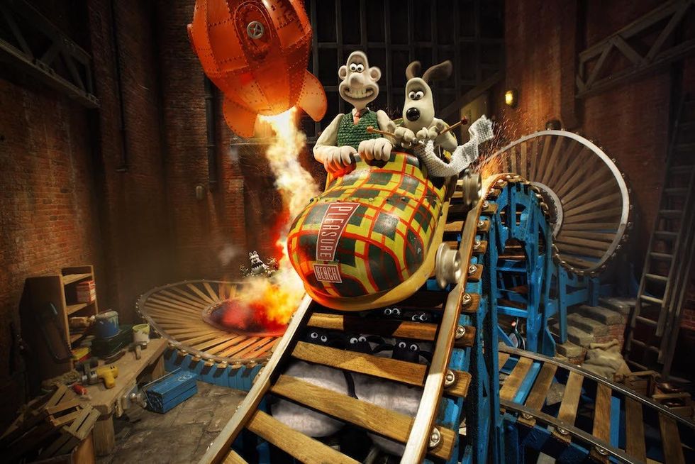 Wallace and Gromit on a rocket ride in a whimsical, mechanical setting.