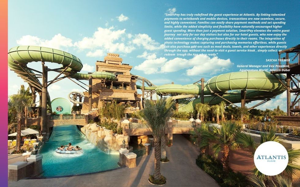 Waterpark with slides, lazy river, and Atlantis Dubai branding under a clear sky.