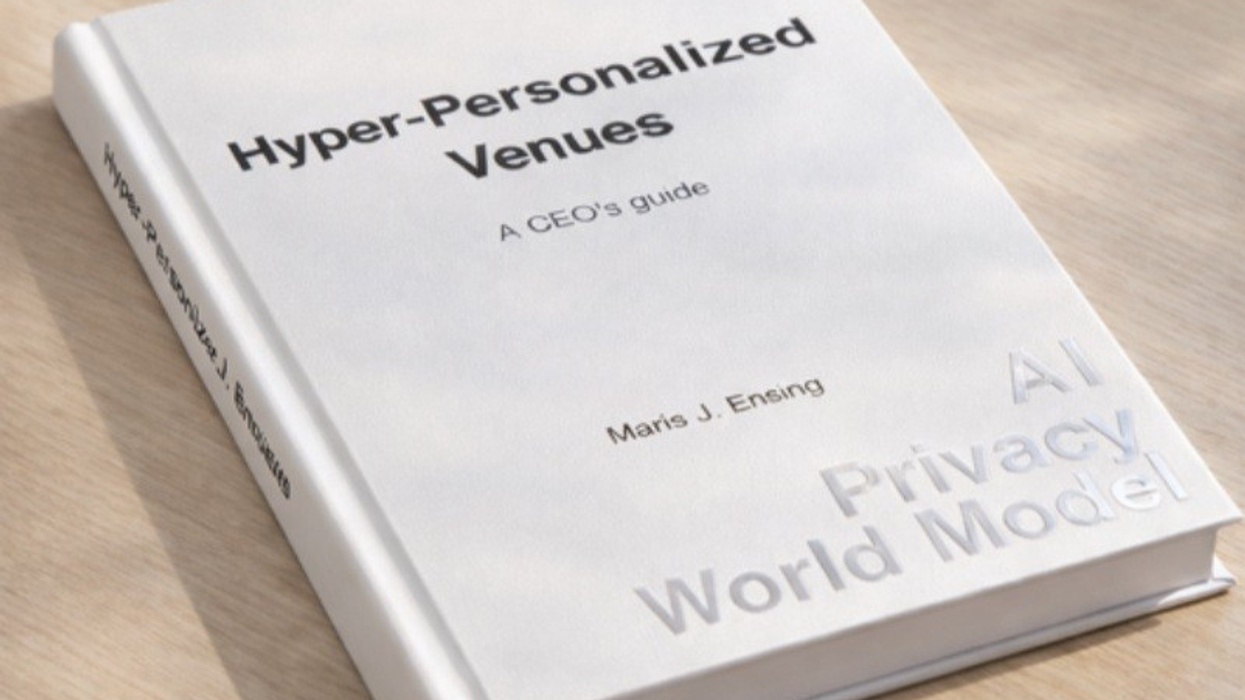 White book titled "Hyper-Personalized Venues: A CEO's Guide" on a wooden surface.