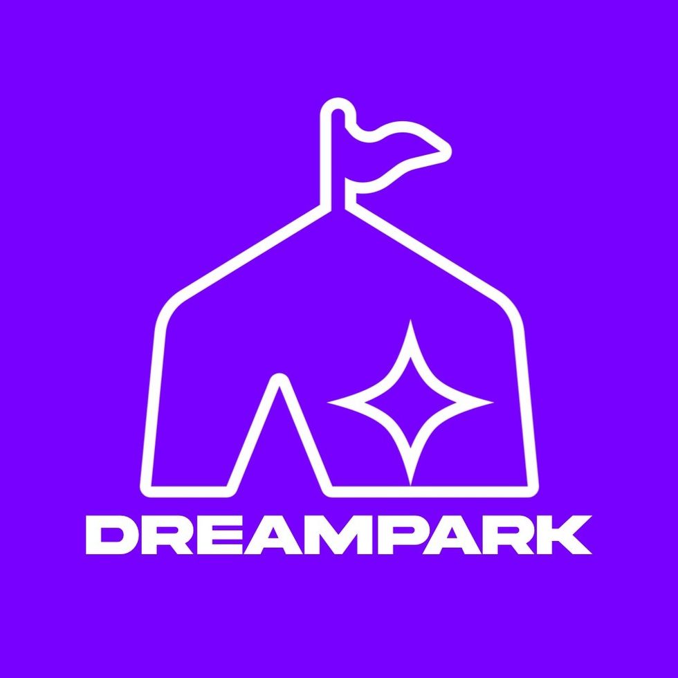 White tent logo with a star and flag, "DREAMPARK" text below on purple background.