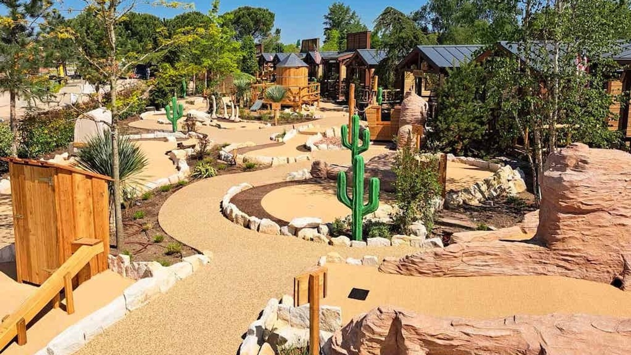 Wild West themed mini-golf course with cacti and rock formations.
