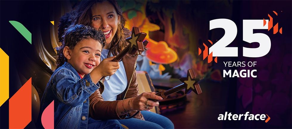 Woman and child enjoying a colorful game, celebrating 25 years of Alterface magic.