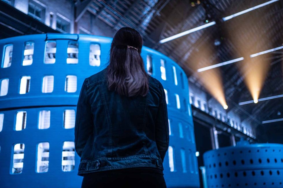 woman looking at illuminated building