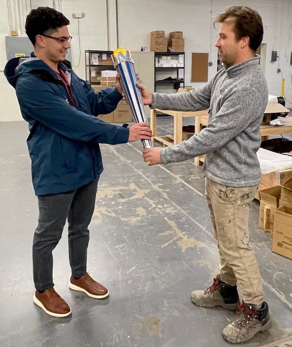 World University Games torch getting passed from Adirondack Studios to the Sports Council