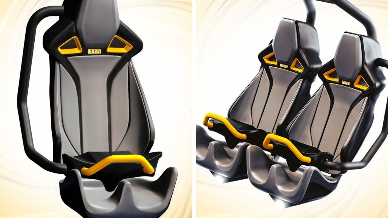 Yellow and black amusement ride seats, single and double, with harnesses.
