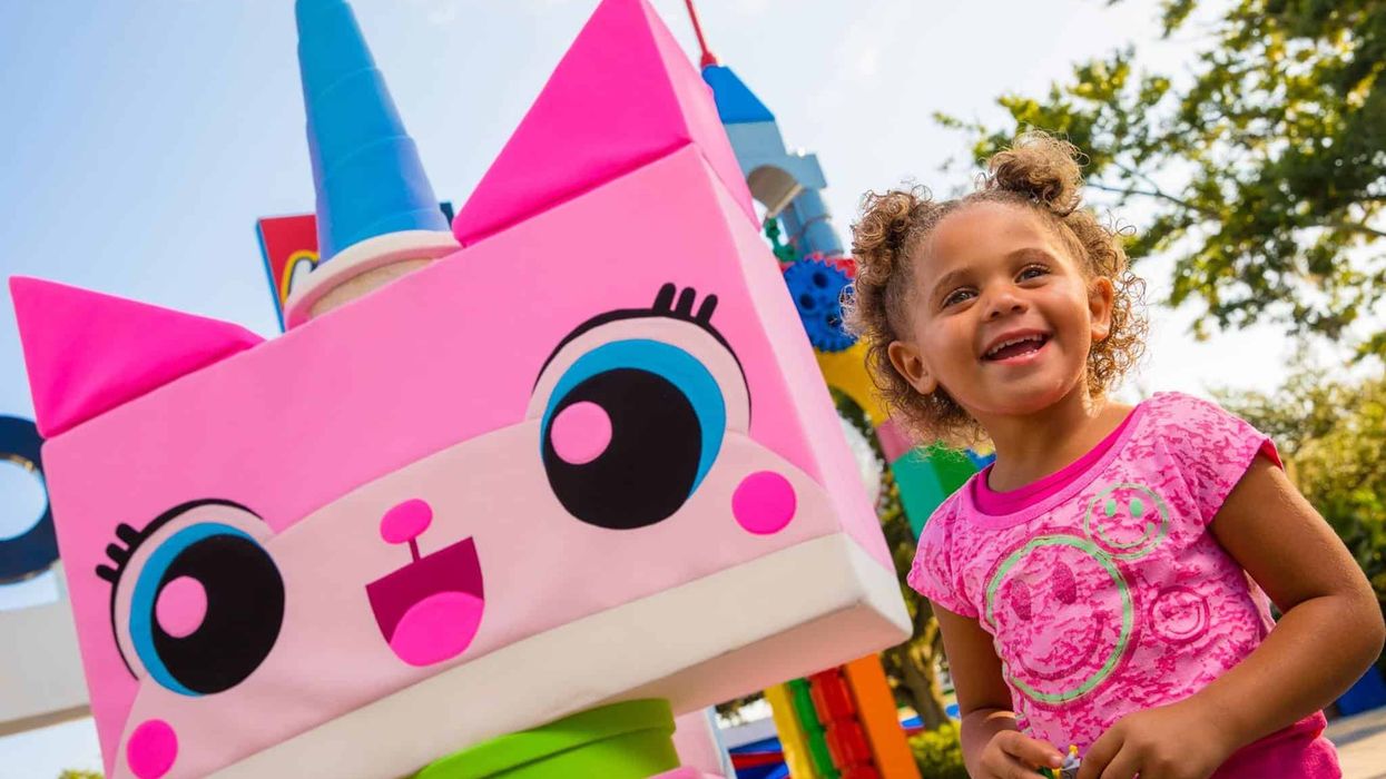 Young girl poses with Unikitty lego at Legoland Florida