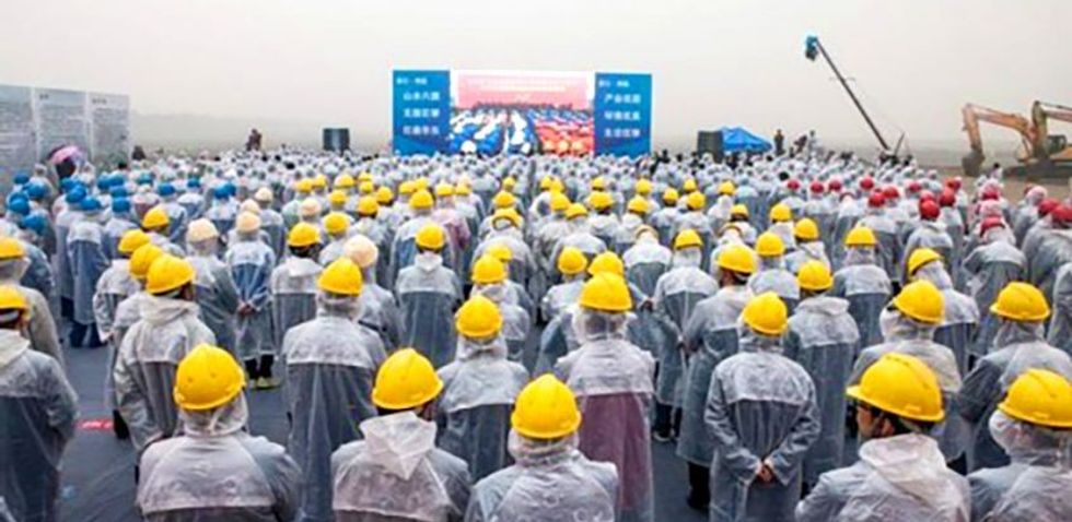 Zhejiang six flags workers in yellow hats Blooloop